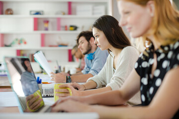 People working at conference table in office