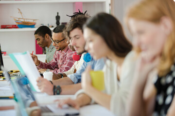 People working at conference table in office