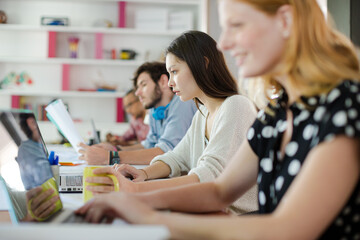 People working at conference table in office