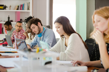 People working at conference table in office
