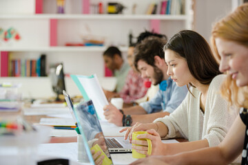 People working at conference table in office