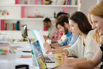 People working at conference table in office