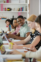 People working at conference table in office