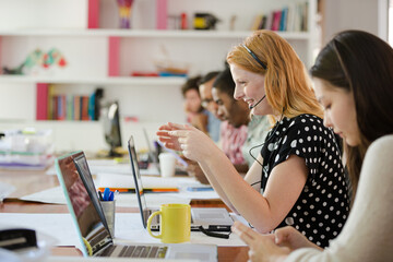 People working at conference table in office