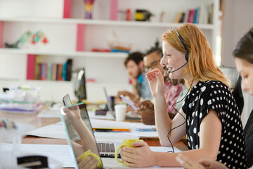People working at conference table in office
