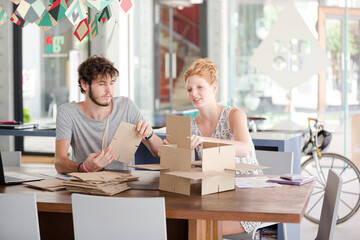 People building model together