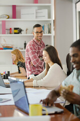 Man eating and working at conference tablet