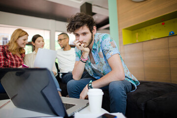 Man using laptop in office