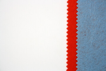 Textile background made of blue and orange felt. Top view.