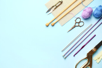 Composition with knitting supplies on color background
