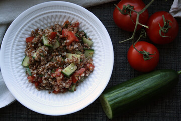 Salad of buckwheat, tomatoes, cucumbers and dill.