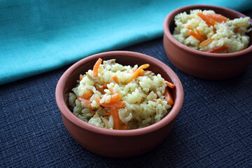 Flavorful pilaf of rice, carrots and chicken.