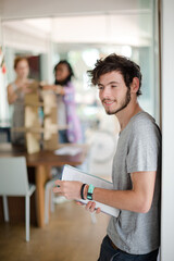 Man reading folders in office