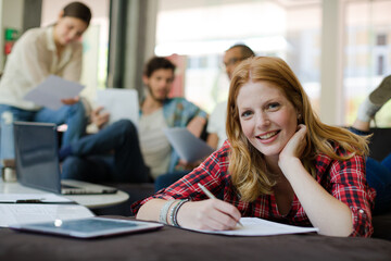 Woman writing in office