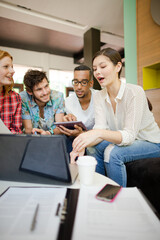 People working at laptop in office