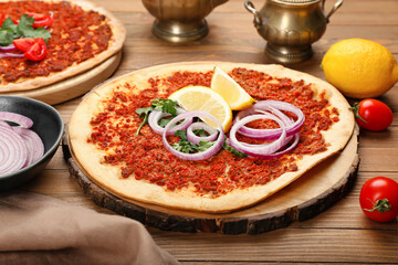 Board with delicious Turkish pizza on wooden background