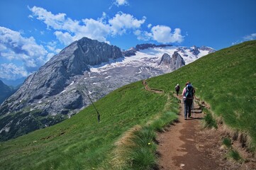 Fototapeta na wymiar Hiking among amazing rocks of Dolomite mountains in Italy