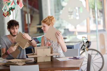 People building model together