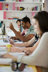 People working at conference table in office