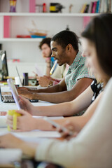 People working at conference table in office