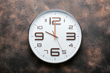 Stylish clock on grunge background