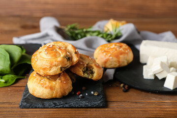 Puff pastry stuffed with spinach on table