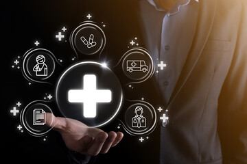 Businessman hold virtual plus medical network connection icons. Covid-19 pandemic develop people awareness and spread attention on their healthcare.Doctor,document,medicine,ambulance,patient icon.