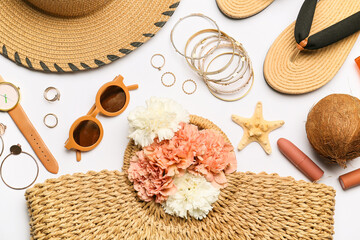 Set of beach accessories and flowers on white background, closeup