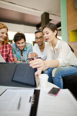 People working at laptop in office