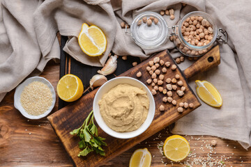 Fototapeta premium Healthy eating and plant-based nutrition, homemade hummus ingredients with chickpeas, lemon, and garlic