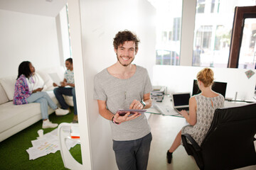 Obraz premium Man using digital tablet in office