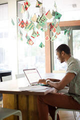 Man working on laptop at office