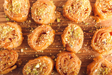 Delicious baklava on wooden background, closeup