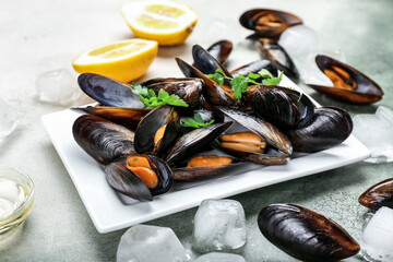 Plate with raw mussels on table - obrazy, fototapety, plakaty