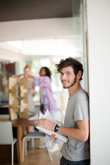 Man reading folders in office