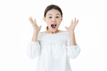 Isolated studio shot of Asian shocked excited surprised clueless female model in casual long sleeve shirt standing open mouth wide show teeth look at camera holding hands up on white background