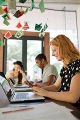 Woman working at conference table in office