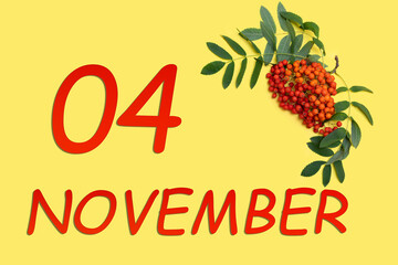 Rowan branch with red and orange berries and green leaves and date of 4 november on a yellow background.