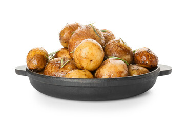 Frying pan with baked potatoes and rosemary on white background