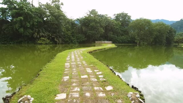 Walking through a lake in Taiping Lake gardens