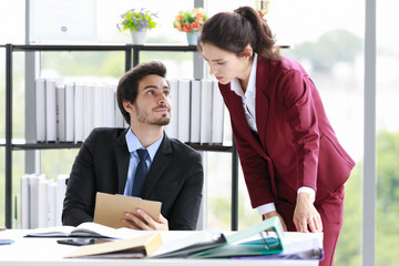 Businessman and businesswoman arguing in office