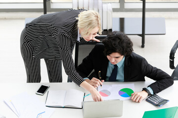 Multiracial colleagues working with data together