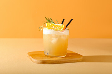 Glass of tasty whiskey sour cocktail on color background