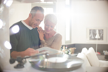 Older couple listening to vinyl records
