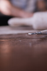 Obraz premium Vertical photo of dirty hands working with clay