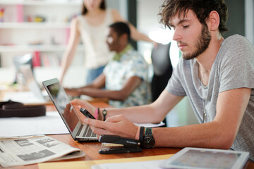 Man working on laptop in office