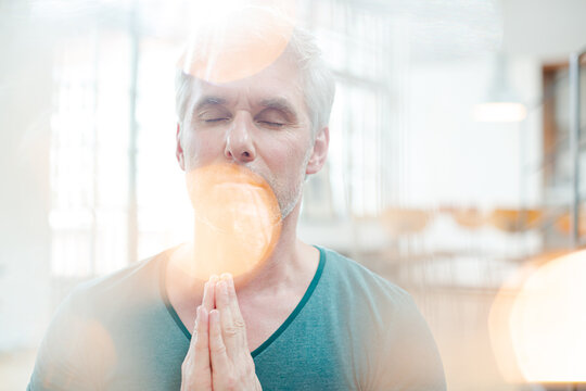 Close up of older man meditating