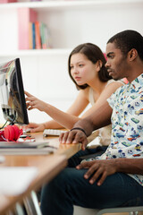 People working on computer in office