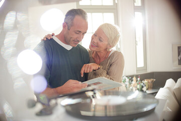 Older couple listening to vinyl records