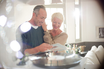 Older couple listening to vinyl records